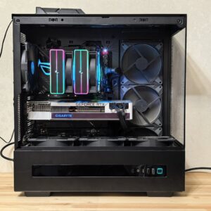 Close-up of a gaming PC with RGB lights and advanced cooling system.